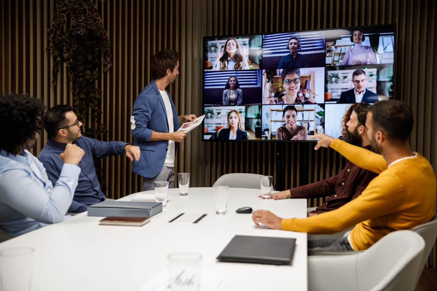 Group of businessmen having a virtual business meeting with their colleagues